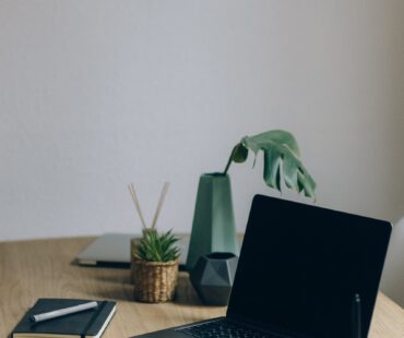 Free Black Laptop Computer On Brown Wooden Table Stock Photo