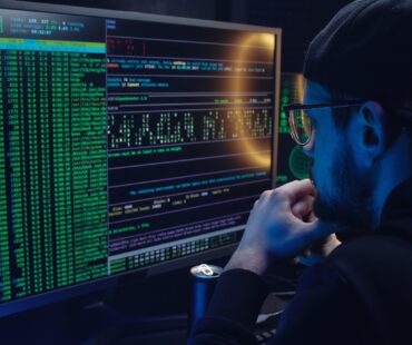 Free A Man Looking at a Computer Screen with Data Stock Photo
