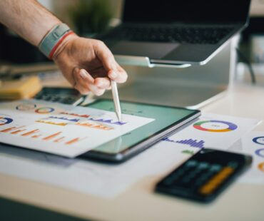 a person is writing on a piece of paper