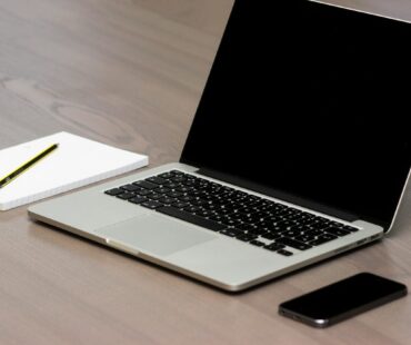 Free Silver Macbook Beside Iphone Stock Photo