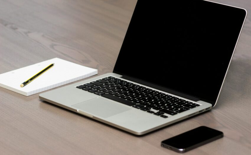 Free Silver Macbook Beside Iphone Stock Photo