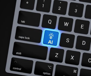 a close up of a keyboard with a blue button